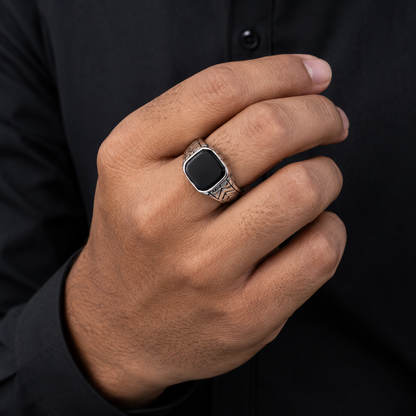 Men's geometric square black onyx signet ring worn on finger