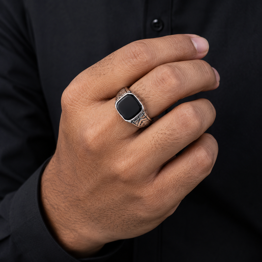 Men's geometric square black onyx signet ring worn on finger
